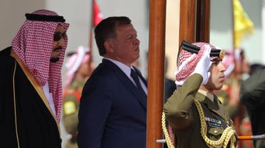 Jordan's King Abdullah II and Saudi Arabia's King Salman bin Abdulaziz Al Saud review honour guards at the airport in Amman, Jordan March 27, 2017. REUTERS/Ammar Awad