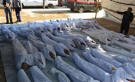  ATTENTION EDITORS - VISUALS COVERAGE OF SCENES OF DEATH AND INJURY Syrian activists inspect the bodies of people they say were killed by nerve gas in the Ghouta region, in the Duma neighbourhood of Damascus August 21, 2013. REUTERS/Bassam Khabieh