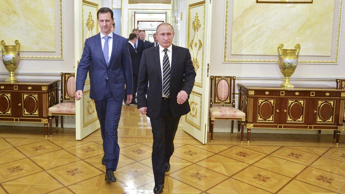 Russian President Vladimir Putin (R) and Syrian President Bashar al-Assad enter a hall during a meeting at the Kremlin in Moscow, Russia, October 20, 2015. To match INSIGHT MIDEAST-CRISIS/SYRIA-ALEPPO-FALL Alexei Druzhinin/RIA Novosti/Kremlin/via REUTERS/File Photo ATTENTION EDITORS - THIS IMAGE HAS BEEN SUPPLIED BY A THIRD PARTY. Reuters