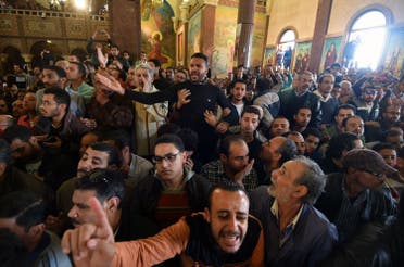 Men mourn for the victims of the blast at the Coptic Christian Saint Mark's church in Alexandria the previous day during a funeral procession at the Monastery of Marmina in the city of Borg El-Arab, east of the northern port city, on April 10, 2017. Egypt prepared to impose a state of emergency after jihadist bombings killed dozens at two churches in the deadliest attacks in recent memory on the country's Coptic Christian minority. (AFP)