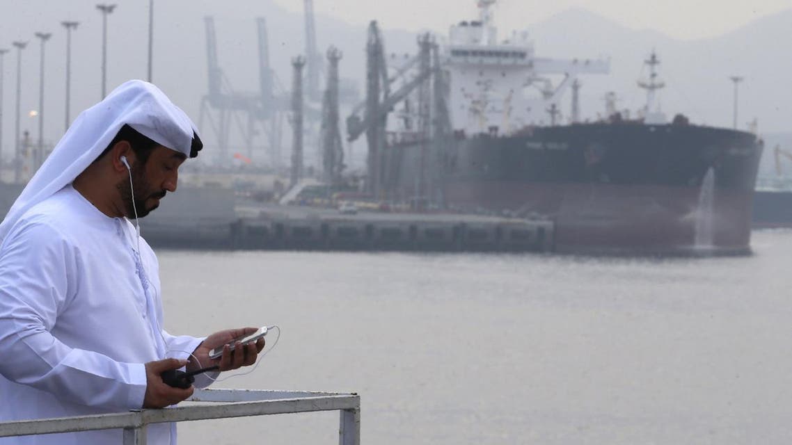 An Emirati man stands at the oil terminal of Fujairah during the inauguration ceremony of a dock for supertankers on September 21, 2016. (AFP)