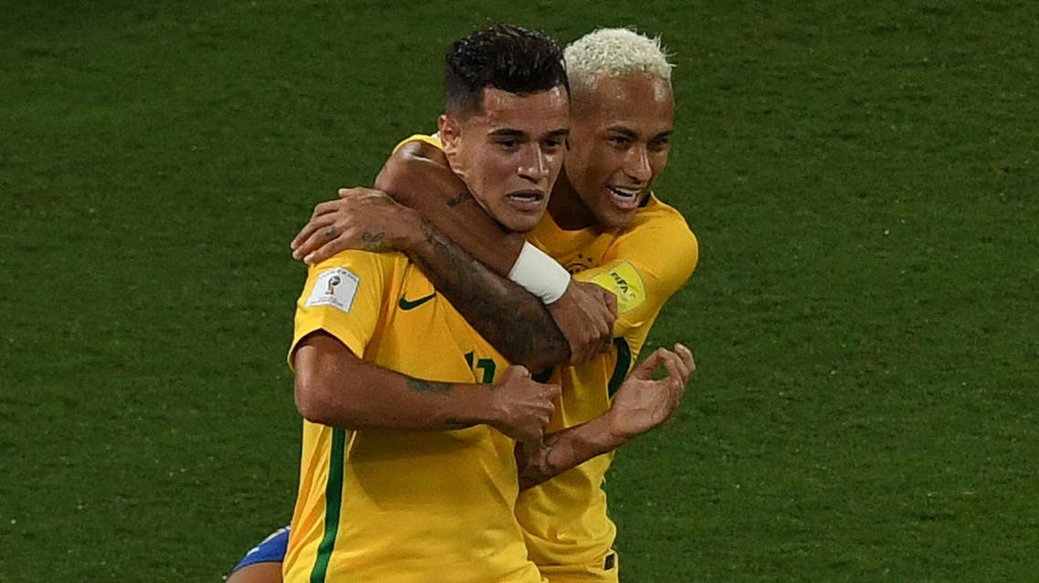 Brazil's Philippe Coutinho (L) celebrates his goal against Bolivia with teammate Neymar during their Russia 2018 World Cup qualifier football match in Natal, Brazil, on October 6, 2016. (AFP)