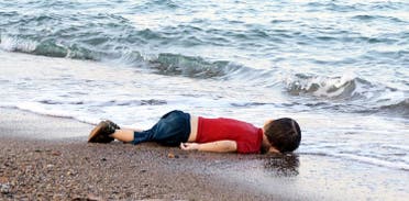 The body of Aylan Kurdi lies on the shores of Bodrum, southern Turkey, on September 2, 2015 after a boat carrying refugees sank while reaching the Greek island of Kos (File Photo: AFP/Nilufer Demir)