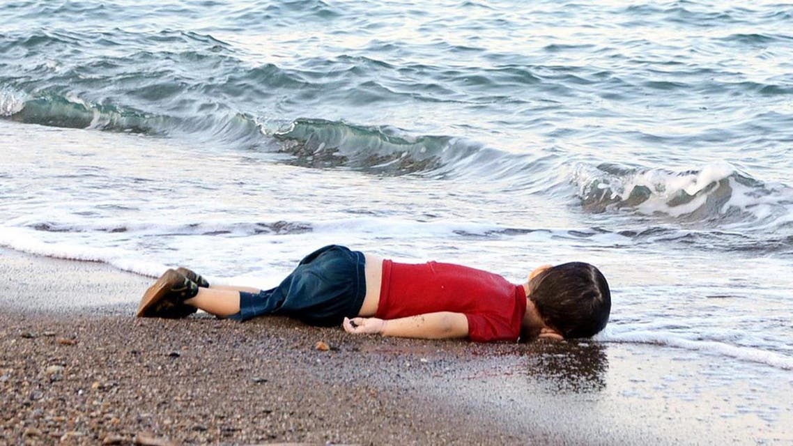 The body of Aylan Kurdi lies on the shores of Bodrum, southern Turkey, on September 2, 2015 after a boat carrying refugees sank while reaching the Greek island of Kos (File Photo: AFP/Nilufer Demir)