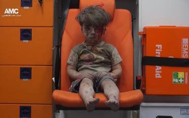 Five-year-old Omran Daqneesh sits in an ambulance after being pulled out of a building hit by an airstrike in Aleppo, Syria, on Aug. 17, 2016 (File Photo: AFP/Aleppo Media Center)