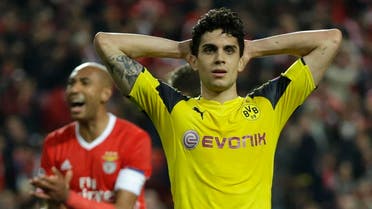 Dortmund's Marc Bartra reacts next to Benfica's Luisao during the Champions League round of 16, first leg, soccer match between Benfica and Borussia Dortmund at the Luz stadium in Lisbon, Tuesday, Feb. 14, 2017. (AP Photo/Armando Franca)