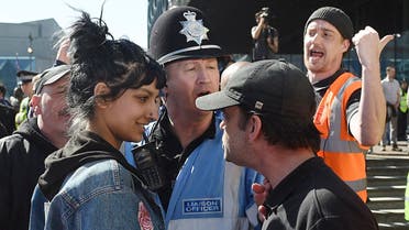 An English Defence League (EDL) protestor, right, clashes with a member of the public during a demonstration in the city of Birmingham, England Saturday April 8, 2017 in the wake of the Westminster attack. ap