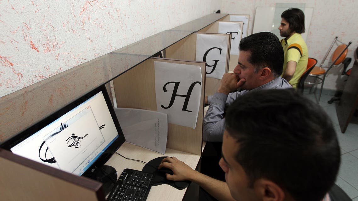 Iranians use computers at a cybercafe in the center of the Iranian capital Tehran on May 14, 2013