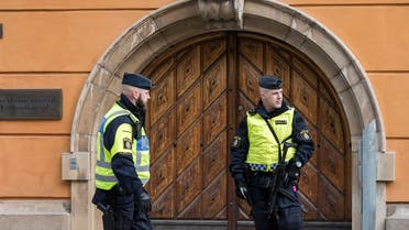 Policemen secure the entrance to the Stockholm District Court where Uzbek national Rakhmat Akilov (not in picture), prime suspect in the Stockholm truck attack, appeared in court on April 11, 2017. (AFP)