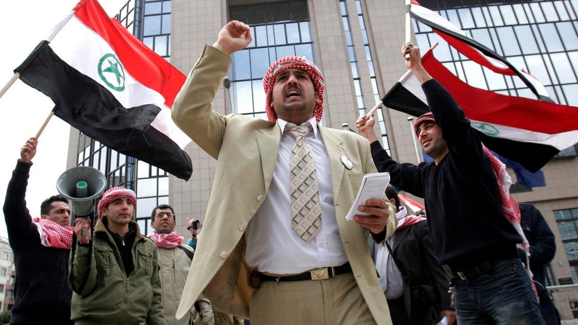An unidentified man chants as others wave the flag of the Al Ahwaz Liberation Organization during a protest in front of the European Council building in Brussels, on April 18, 2008. (AP)