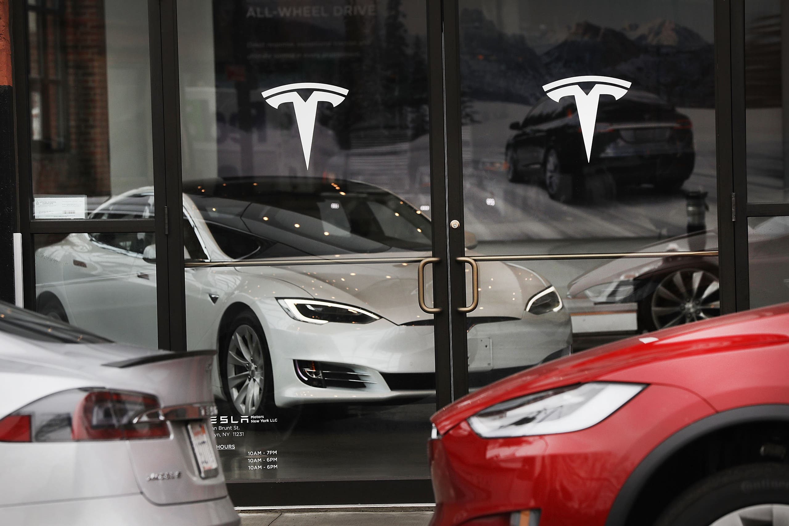 Tesla electric cars in a showroom