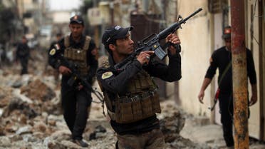 Iraqi counter-terrorism service (CTS) forces advance towards the Sekak neighbourhood in western Mosul on April 11, 2017, during the ongoing offensive to retake the city from ISIS AFP