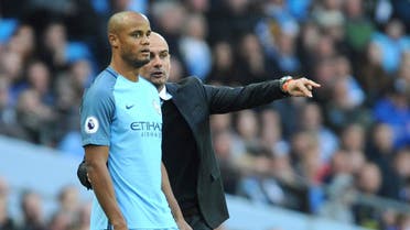 Manchester City manager Josep Guardiola, right, brings Manchester City's Vincent Kompany as a substitute during the English Premier League soccer match between Manchester City and Everton at the Etihad Stadium in Manchester, England, Saturday, Oct. 15, 2016. (AP)