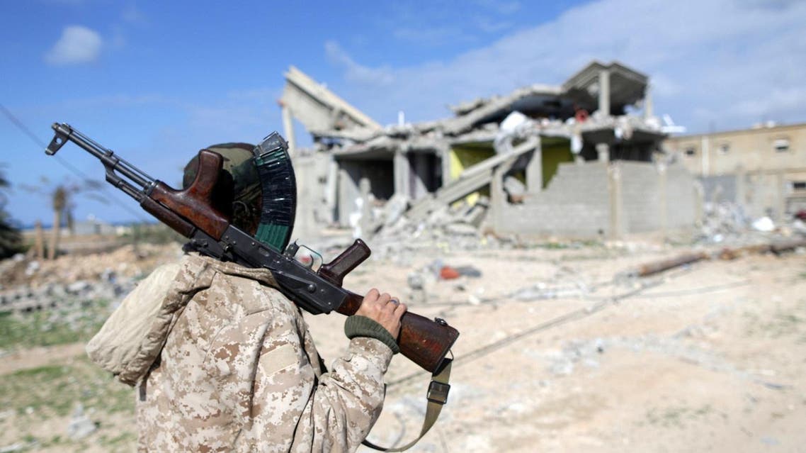 A member of East Libyan forces holds his weapon as he stands in front of a destroyed house in Ganfouda district in Benghazi, Libya, January 28, 2017. (File photo: Reuters)