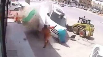 WATCH: Workman in lucky escape with runaway van on Saudi road