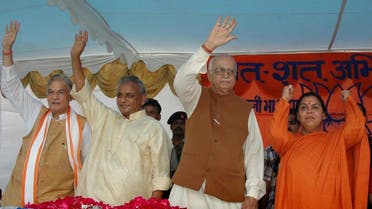 In this July 28, 2005 file photo, L.K. Advani, second right, Uma Bharati, right, Kalyan Singh, second left, and Murli Manohar Joshi wave to people during a public rally in Rae Bareilly, in Uttar Pradesh. (AP)