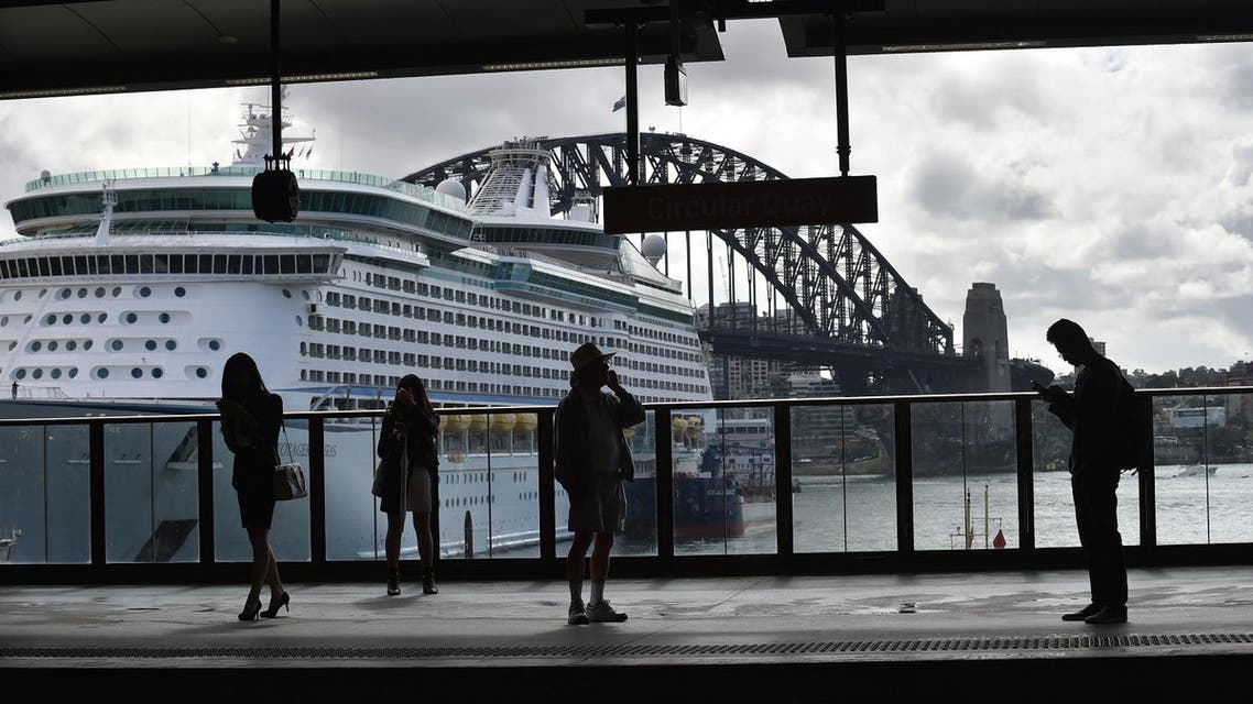 People wait for a train at Circular Quay in Sydney on April 19, 2017. (AFP)