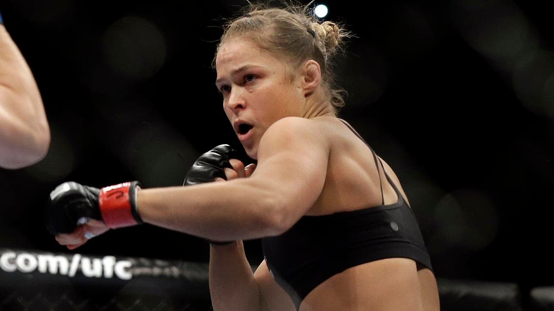 Ronda Rousey fights Sara McMann during a UFC 170 mixed martial arts women's bantamweight title bout on Feb. 22, 2014, in Las Vegas. (AP)