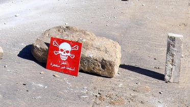 A hazard sign at a site hit by an airstrike on Tuesday in the town of Khan Sheikhoun in rebel-held Idlib, Syria April 5, 2017. The hazard sign reads, "Danger, unexploded ammunition". (Reuters)
