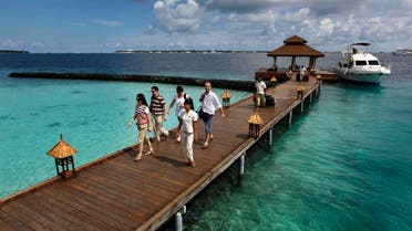 In this Feb. 12, 2012 file photo, foreign tourists arrive in a resort in the Kurumba island in Maldives. (AP)