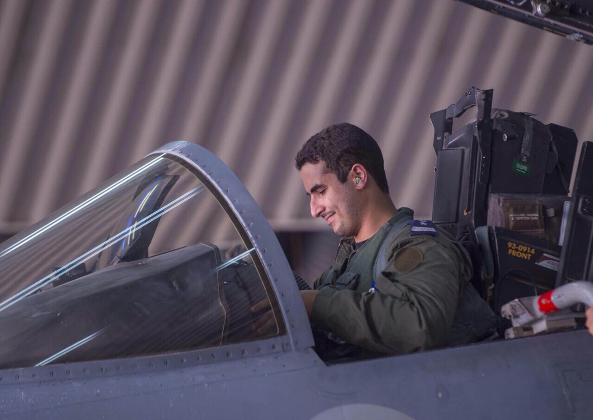 In a handout picture released by the official Saudi Press Agency (SPA), Saudi Arabian air force pilot Prince Khaled bin Salman sits in the cockpit of a fighter jet at an undisclosed location on September 23, 2014. (AFP)