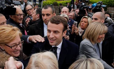 Macron, head of the political movement En Marche !, or Onwards !, and candidate for the 2017 French presidential election, greets supporters during in the first round of 2017 French presidential election at a polling station in Le Touquet. (Reuters)
