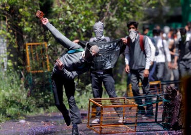 A Kashmiri student throws a brick at police as they clash in Srinagar, Indian controlled Kashmir, Monday, April 24, 2017. (AP)