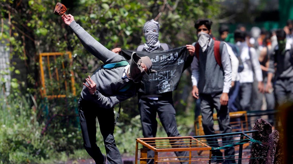 A Kashmiri student throws a brick at police as they clash in Srinagar, Indian controlled Kashmir, Monday, April 24, 2017. (AP)