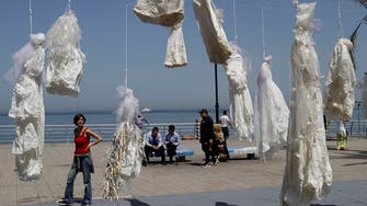 IN PICTURES: Wedding dresses hang in Beirut seafront protest against rape laws