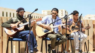 Libyans in Benghazi are arming themselves with music, literature