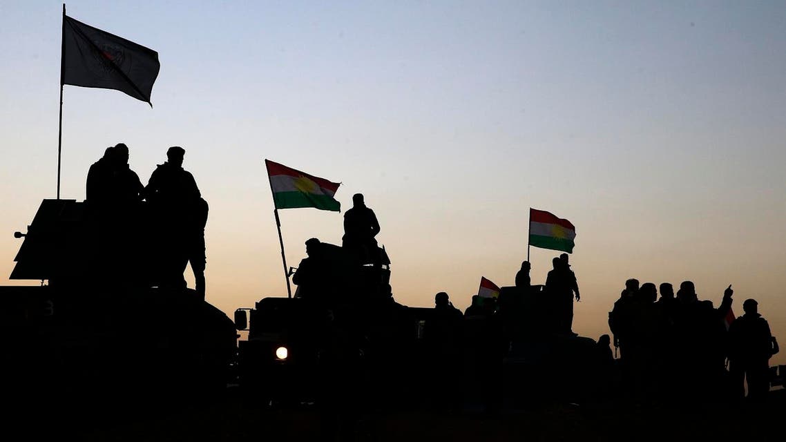 Kurdish Peshmerga fighters stand on top of a military vehicle as they advance towards villages surrounding Mosul. (File photo: AP)