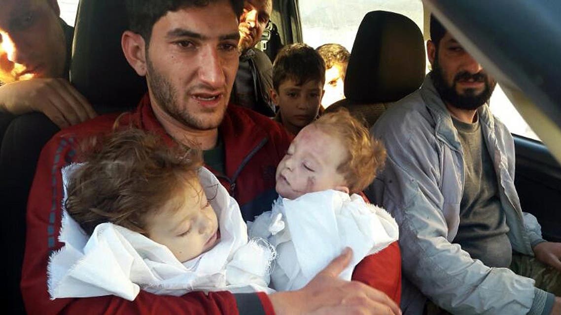 In this Tuesday April 4, 2017 file photo, Abdel Hameed Alyousef, 29, holds his twin babies who were killed during a suspected chemical weapons attack, in Khan Sheikhoun in the northern province of Idlib, Syria (File Photo: Alaa Alyousef via AP)