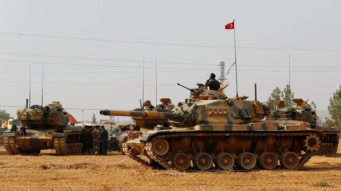 Turkish army tanks and military personal are stationed in Karkamis on the Turkish-Syrian border in the southeastern Gaziantep province, Turkey, August 25, 2016. REUTERS/Umit Bektas/File Photo