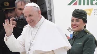 Pope Francis waves to the press as he is welcomed by Alitalia's personnel prior his flight to Egypt, on April 28, 2017 at Rome's Fiumicino airport. Pope Francis heads for a two-day visit in Egypt for talks with the grand imam of the capital's famed Al-Azhar mosque in Cairo, but also to show solidarity with Coptic Christians targeted by violence in Egypt. (AFP)