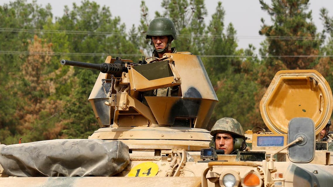 Turkish soldiers on an armoured vehicle are seen in Karkamis on the Turkish-Syrian border in the southeastern Gaziantep province, Turkey, August 25, 2016. REUTERS/Umit Bektas