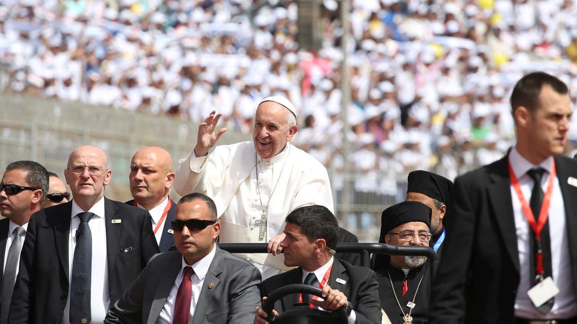 Pope Francis waves as he arrives to lead a mass in Cairo, Egypt April 29, 2017. REUTERS/Alessandro Bianchi