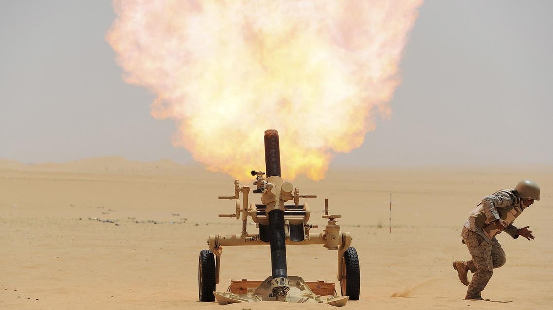 GRAPHIC CONTENT: A Saudi soldier fires a mortar towards Houthi movement position, at the Saudi border with Yemen April 21, 2015. REUTERS/Stringer