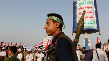 A Houthi militant stands guard at the site of a rally held to show support to the Houthi rebels and their allies and also to denounce preparations by the Yemeni government and its Arab allies to launch an assault on the port city according to the organisers, in the Red Sea port city of Hodeidah, Yemen, April 6, 2017. The poster reads, "Allah is the greatest. Death to America, death to Israel, a curse on the Jews, victory to Islam". REUTERS/Abduljabbar Zeyad