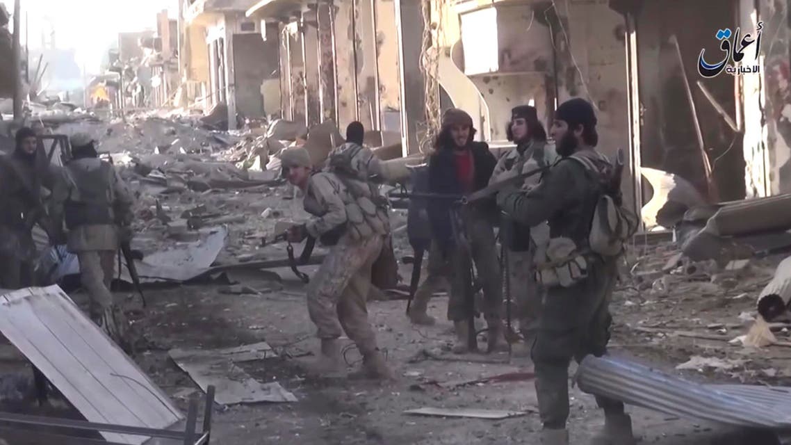 ISIS fire during a a battle against the Syrian government forces, at al-Sinaa neighborhoods, in Deir el-Zour, east of Syria. AP