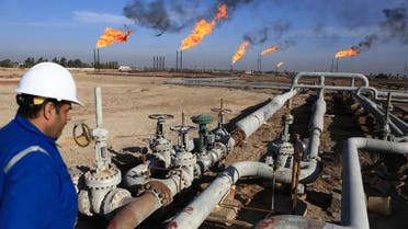An Iraqi worker worker prepares to operate valves in Nihran Bin Omar field north of Basra, 340 miles (550 kilometers) southeast of Baghdad, Iraq, Thursday, Jan. 12, 2017. Iraq's state-run South Gas Company inaugurated a gas pipeline to transport gas, a by-product of oil production, from Nihran Bin Omar field to the national network. (AP Photo/ Nabil al-Jurani)