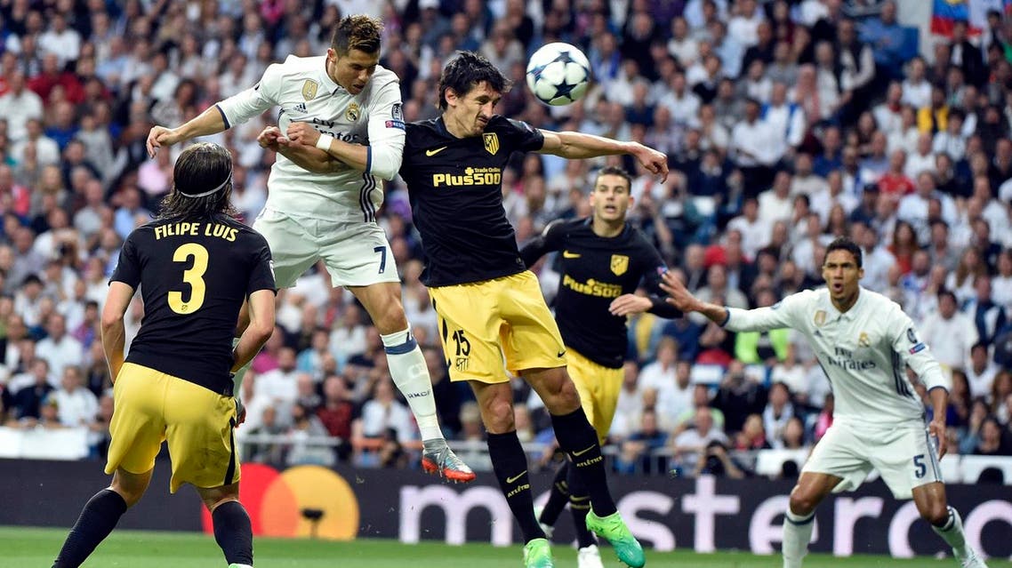 Real Madrid's Portuguese forward Cristiano Ronaldo (2ndL) heads to score during the UEFA Champions League semifinal first leg football match Real Madrid CF vs Club Atletico de Madrid at the Santiago Bernabeu stadium in Madrid, on May 2, 2017. AFP