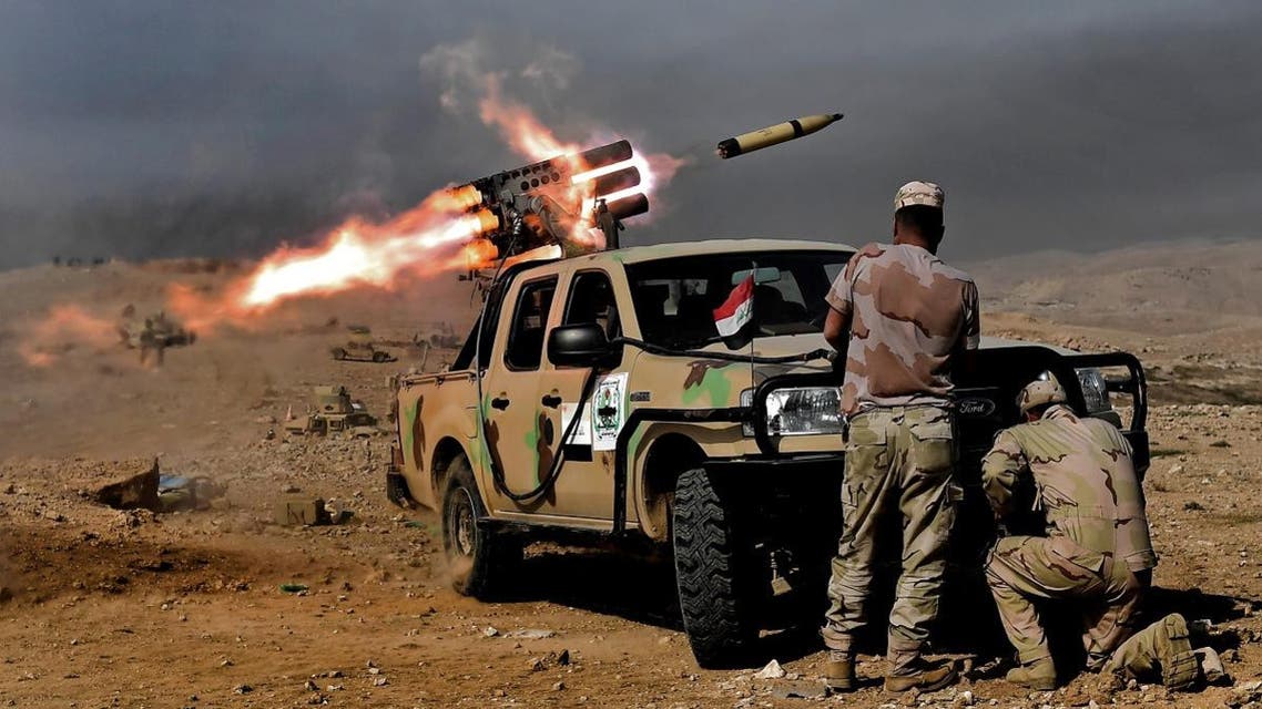 Members of the Iraqi army's 9th Division fire a multiple rocket launcher from a hill in Talul al-Atshana, on the southwestern outskirts of Mosul, on February 27, 2017. (AFP)