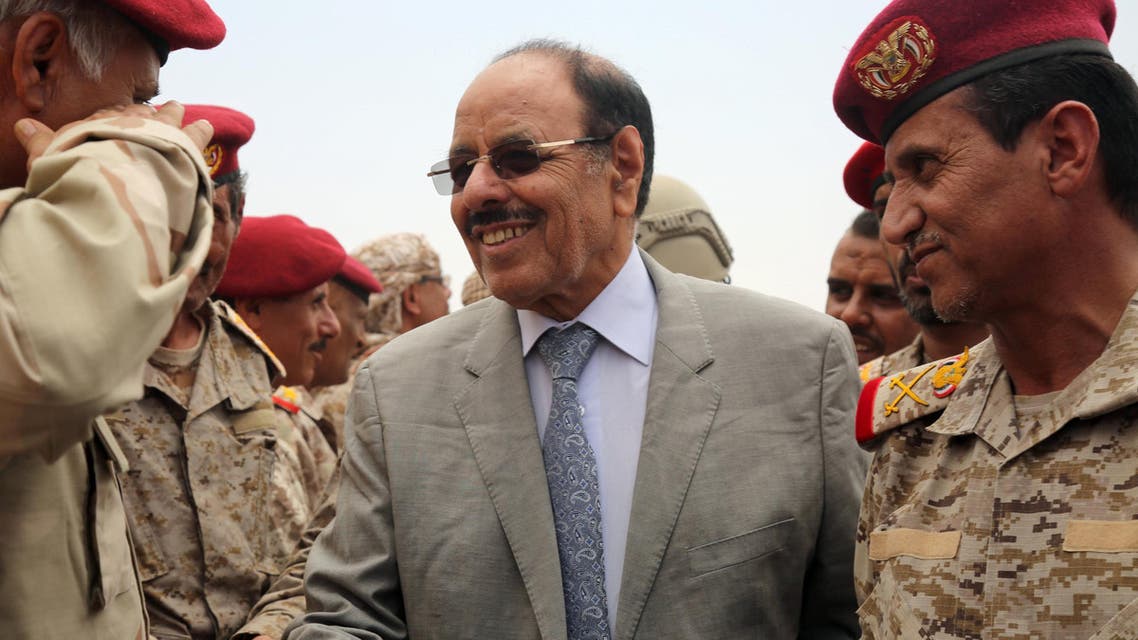 Yemeni Vice President General Ali Mohsen al-Ahmar (C) shakes hands with army officers as he visits military barracks in the eastern city of Marib on August 15, 2016