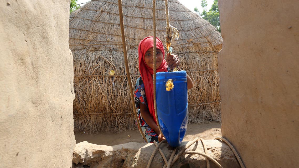 A Yemeni girl collects water from a well on September 26, 2016 in an impoverished coastal village on the outskirts of the rebel-held Yemeni port city city of Hodeida, where malnutrition has hit the population hard.