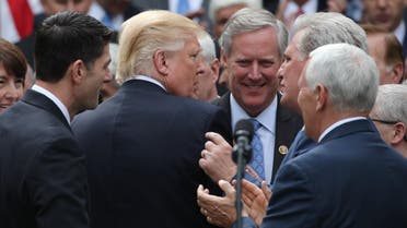 US President Donald Trump (center) is surrounded by Congressional Republicans in the Rose Garden of the White House after the House of Representatives approved the American Healthcare Act.  (Reuters)