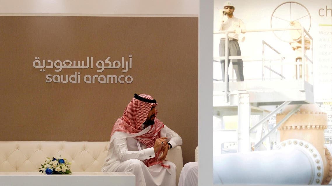 A Saudi Aramco employee sits in the company stand at the Middle East Petrotech 2016, an exhibition and conference for the refining and petrochemical industries, in Manama, Bahrain, September 27, 2016. (Reuters)