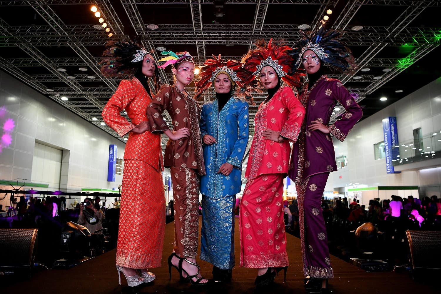 The show, which is part of an international beauty exhibition being held in Kuala Lumpur, showcases creative interpretations of traditional Malay costumes and make-up techniques. (AFP)