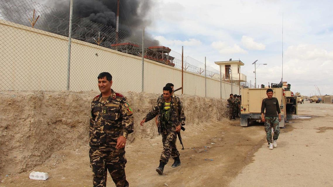 In this March 9, 2016 file photo, smoke rises from a building, where Taliban insurgents hide during a fire fight with Afghan security forces, in Helmand province, Afghanistan. (AP)