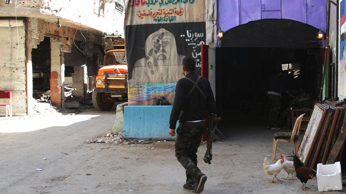 A man walks in a street inside the Yarmuk Palestinian refugee camp in the Syrian capital Damascus on April 6, 2015. Around 2,000 people have been evacuated from the camp after the Islamic State group seized large parts of it. At least 26 people, including civilians as well as fighters from IS and Palestinian factions, had been killed in the camp according to the Syrian Observatory for Human Rights