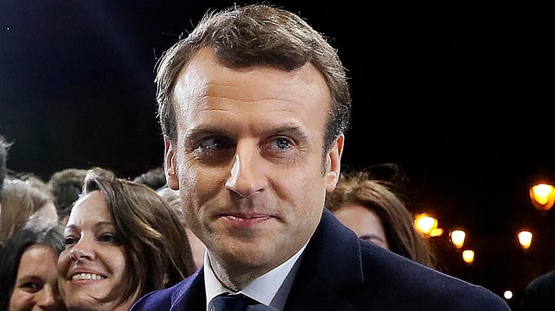 French President elect Emmanuel Macron arrives on stage to deliver a speech during his victory rally near the Louvre museum after results in the 2017 presidential election in Paris. (AFP)